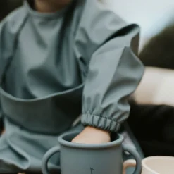 Long-sleeved Bib with integrated pocket 6-24m - Majestic Blue