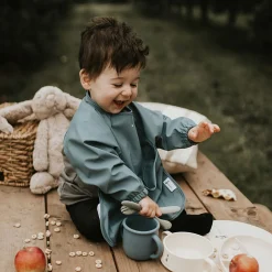 Long-sleeved Bib with integrated pocket 6-24m - Majestic Blue